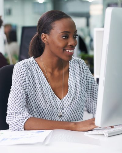 She thoroughly enjoys her job. Shot of a businesswoman working in an office